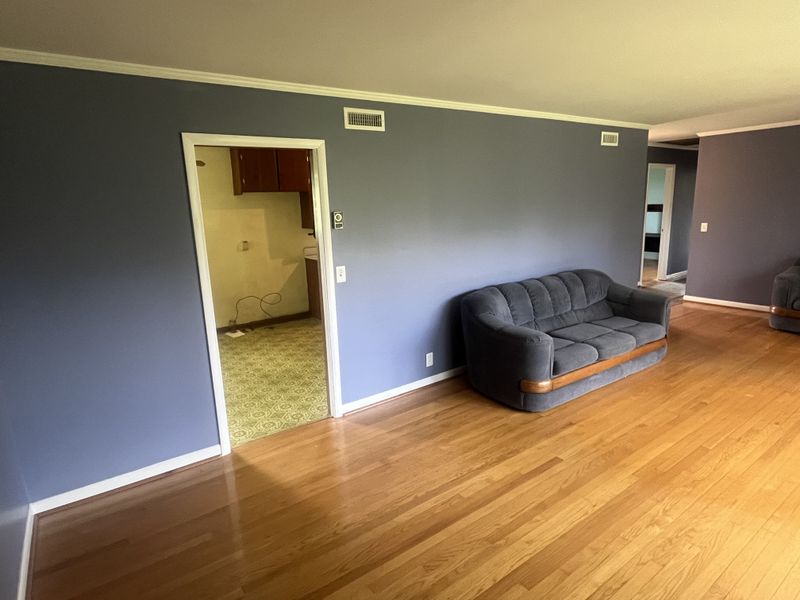 Anchorage Dr interior before — dated blue walls and old kitchen